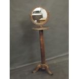 A C19th mahogany adjustable shaving stand with column support and carved cabriole legs, 16''