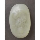A small jade ornament carved with a Quan Yin, 2½" long