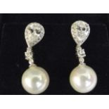 A pair of silver, cubic zirconia and freshwater pearl earrings