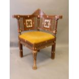 A Syrian corner chair with inlaid Mother of Pearl decoration and inset panels, 35'' high