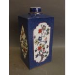 A Chinese blue ground porcelain tea canister with painted enamelled foliate decoration, 7'' high