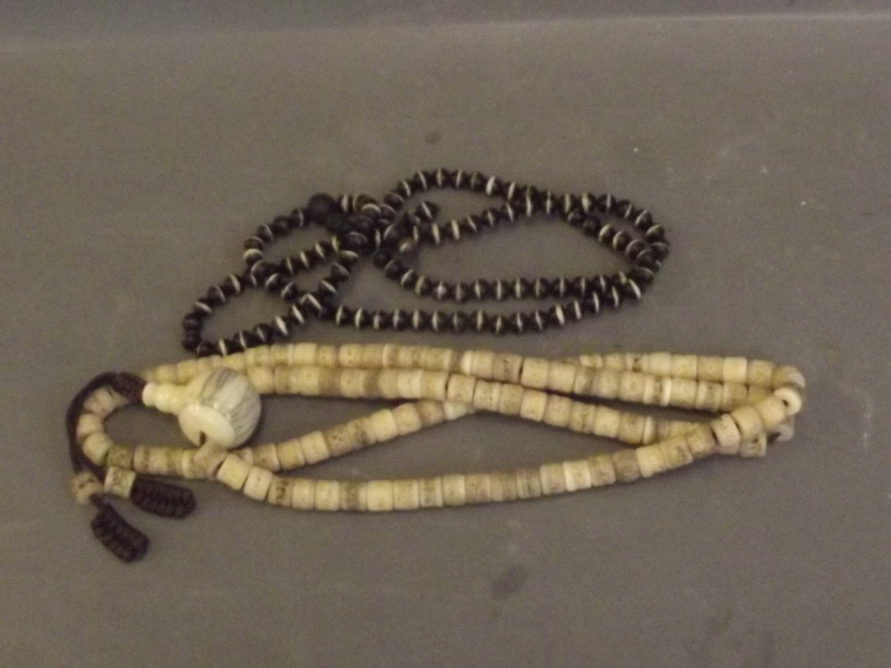 A Tibetan Mala beaded necklace, and another, 30'' long