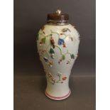 An C18th Chinese porcelain vase with raised enamel decoration of rats and tree blossom and gilt