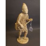 A Meiji sectional ivory figure of a musician, signed to base, 12'' high (AF minor loss to top of