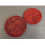 Two cinnabar lacquer dishes with carved decoration of flowers and pavillions, 7'' diameter