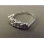 An 18ct white gold five stone diamond ring, approximately 1.75 carats, size P