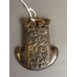 A Chinese jade pendant with raised decoration of coiled dragons, 3'' long