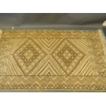 An Oriental hand knotted wool carpet with diamond designs on a beige field, 80'' x 44''