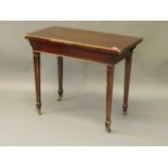 An Edwardian mahogany fold over card table on square tapering supports and spade feet, 36'' x 18'' x