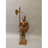 A Nester bronzed fire companion in the form of a suit of armor , 33'' high