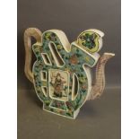 A Chinese pottery teapot in the famille verte palette with painted decoration of a sage , 8'' high