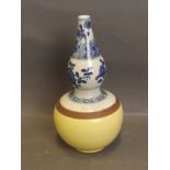 A Chinese yellow ground blue and white bottle vase with floral decoration, 8½'' high