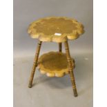 A Kashmiri painted and giltwood shaped top two tier occasional table, 15'' x 20''