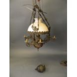 An early C20th Dutch repoussé metal ceiling oil lantern, 34'' long