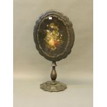 A Victorian papier-mâché shaped tilt top occasional table inset with Mother of Pearl and painted