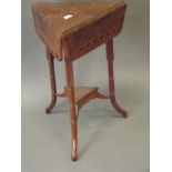 An Oriental hardwood occasional table with three shaped flaps, the top with carved decoration of