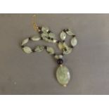 An 18ct gold, jade and bead necklace, 16'' long