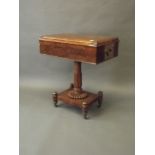 A C19th mahogany work box with lift-up top, on a turned and carved column and platform base