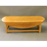An oak drop leaf occasional table on square chamfered supports, 54'' x 16'' x 20'', 38'' extended