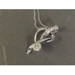 An 18ct white gold pendant necklace set with diamonds