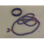 A string of lapis lazuli beads, and a lapis lazuli bracelet, 34'' long