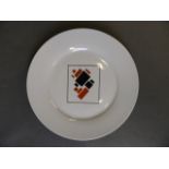 A Russian porcelain plate with painted Constructivist style decoration after Kandinsky, marked 'Made