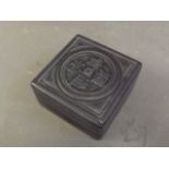 A Chinese black hardstone box carved with calligraphy, containing a soapstone seal, 2½''