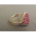 A 9ct gold lady's cluster ring set with rubies, size P