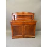 A Victorian mahogany chiffoniere with two drawers over two cupboards and shaped upper shelf,