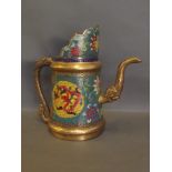 A large Chinese coffee pot with well coloured cloisonné decoration and a dragon spout and handle,