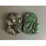 A Chinese apple green jadeite pendant with carved decoration depicting a monkey, and another similar