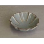 A Chinese blue glazed pottery bowl in the form of a flower, 5'' diameter