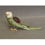 A cold painted bronze pin cushion in the form of a budgerigar, signed 'Bergm', 7'' long