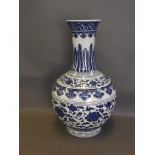 A Chinese blue and white vase decorated with scrolling flowers and leaves, 15'' high