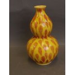 A Chinese yellow ground double gourd vase with red splash glazed decoration, printed mark to base,