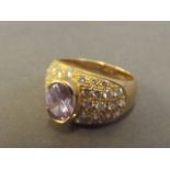 An 18ct gold, diamond and amethyst ring, size M
