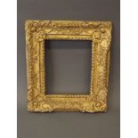 An C18th giltwood picture frame with carved gadroon and scroll decoration, rebate 10'' x 12''