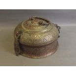 A C19th Persian copper incense burner with pierced body and hinged cover, with all over repoussé and