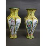 A pair of Cantonese yellow ground enamelled vases of hexagonal form, the panels decorated with