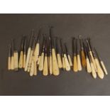 A collection of small button hooks with ivory and bone inlaid handles, 6'' long