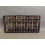 An old wooden abacus, 14½'' long