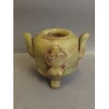 A Chinese green soapstone censer with raised dragon decoration, on tripod supports, 3'' high