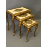 A nest of three occasional tables with incised painted and gilt gessoed decoration, 21'' x 13'',