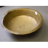 A late C18th/early C19th Persian hammered brass bowl with tingle repairs, 18'' diameter