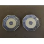 A pair of Chinese Kangxi octagonal blue and white dishes with lotus flower decoration, 4'' diameter