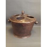 A bronzed cast metal four section wine cooler with twin handles, 13'' high