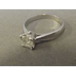 An 18ct white gold radiant cut diamond solitaire ring, size N