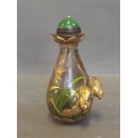 A Peking glass snuff bottle decorated with rats, reeds and flowers, 4'' high