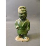 A Chinese green glazed terracotta figure of a dwarf, 8¾'' high
