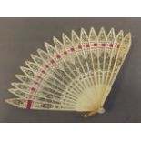 A small C19th Cantonese pierced ivory fan with threaded ribbon, 11'' extended